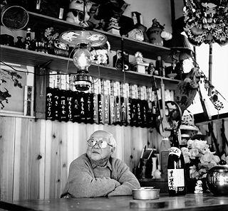 At his bar at home